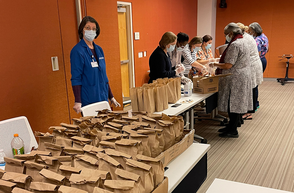 Princeton Health staff members making bag lunches for families served by the Trenton (N.J.) Area Soup Kitchen 